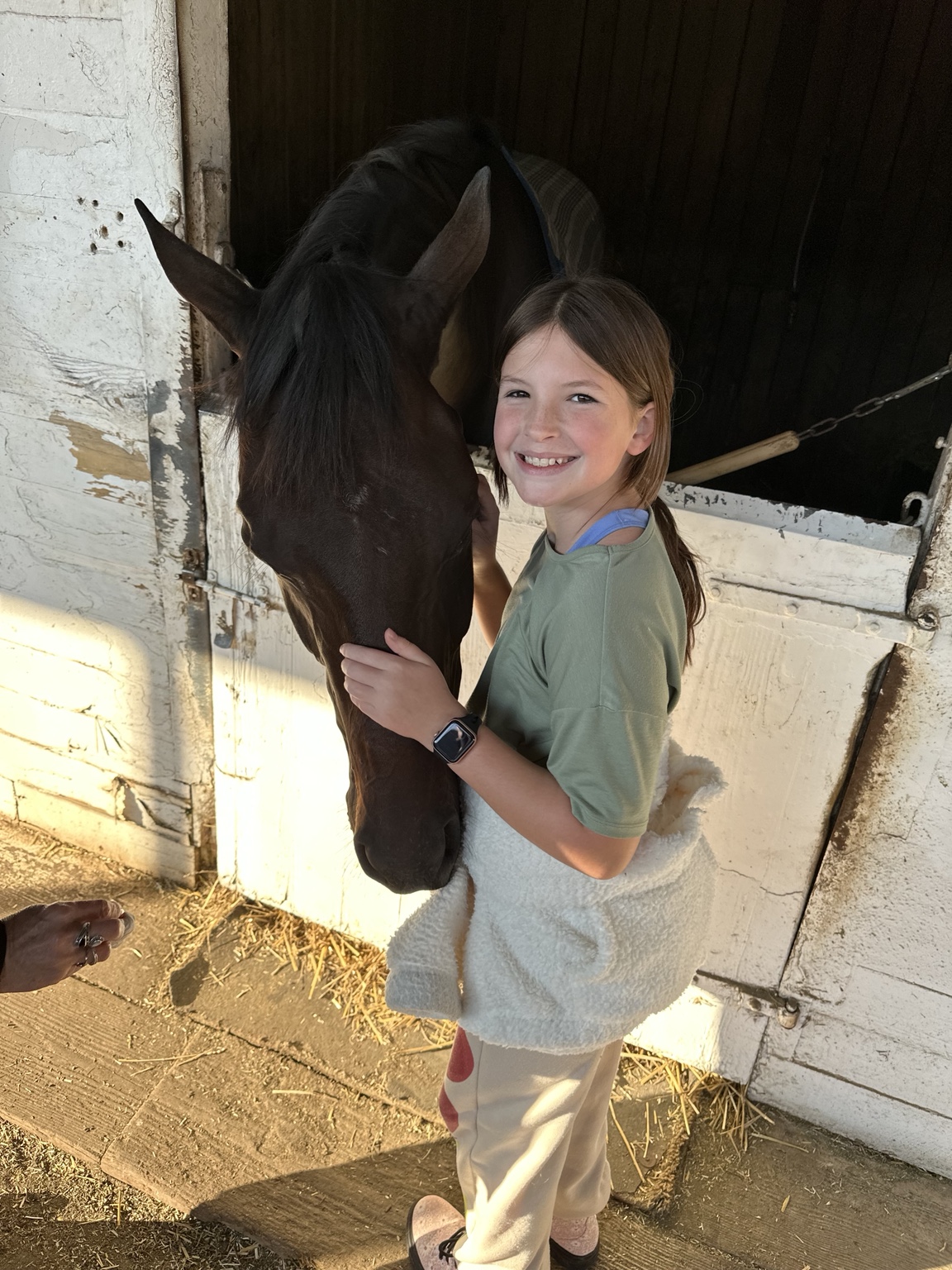 Rachel giving Daisy love back at the barn after her first race
