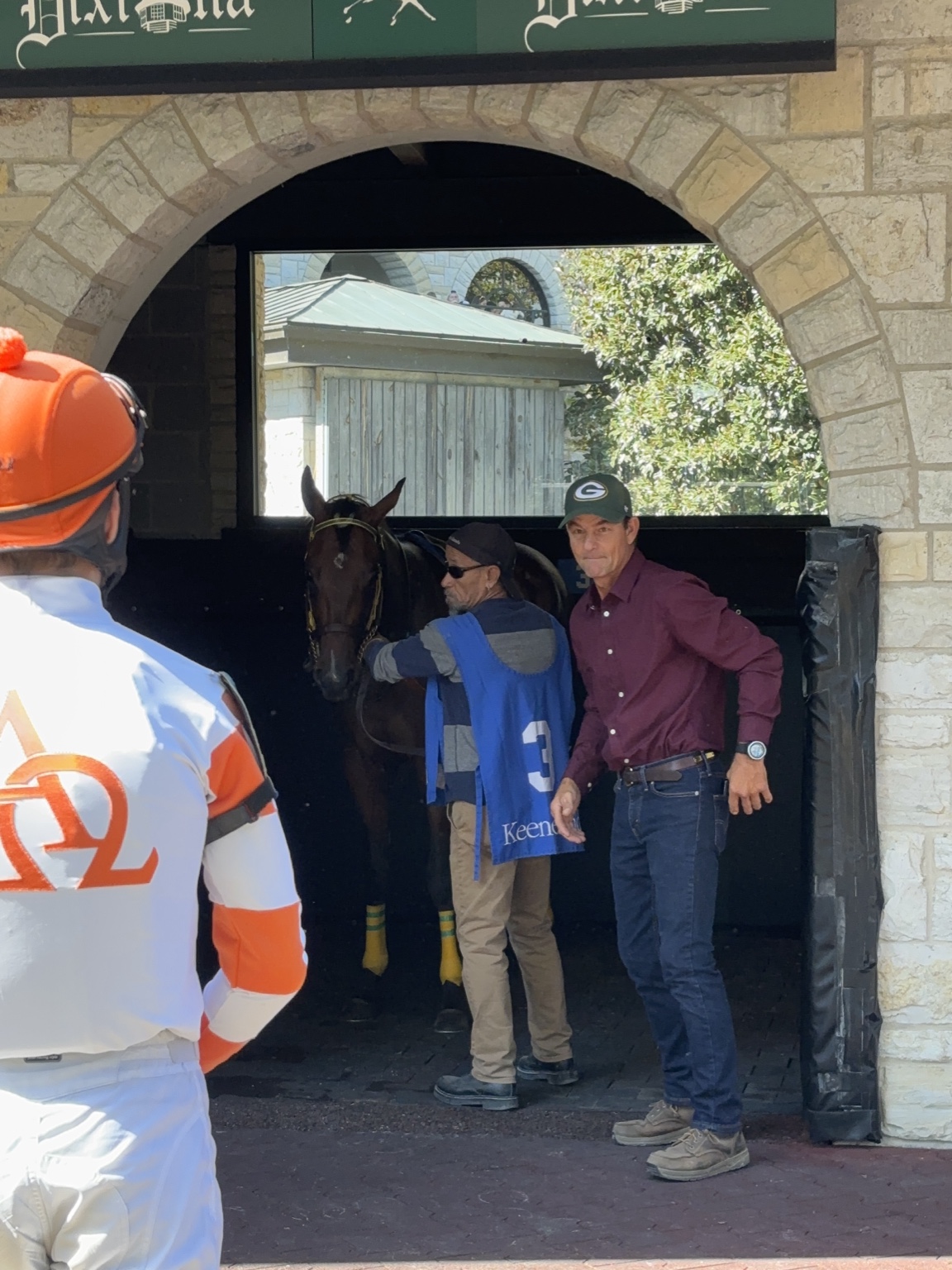 Kachow entering the Keeneland paddock with her race-day team